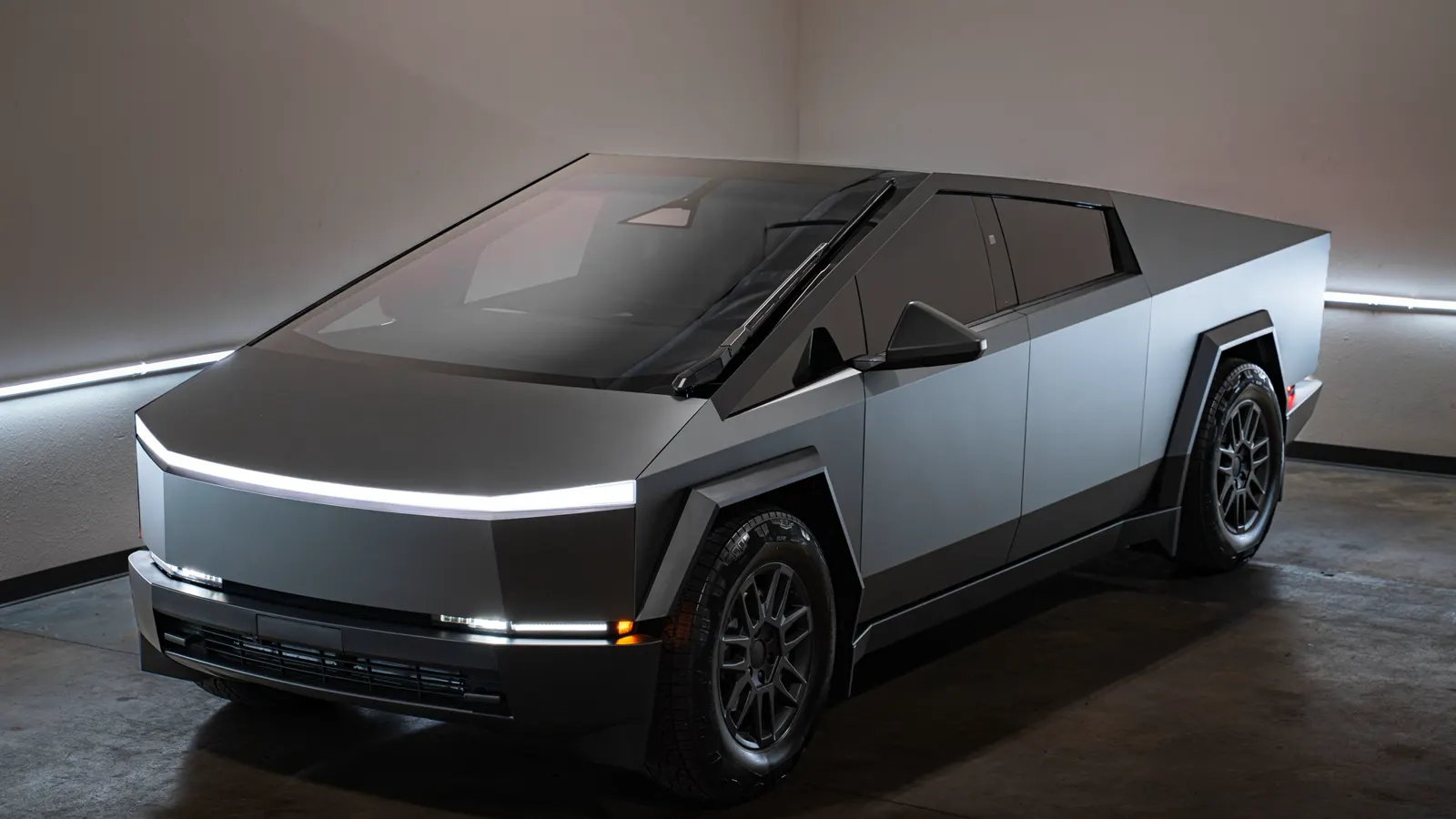 Tesla Cybertruck in a satin finish under studio light
