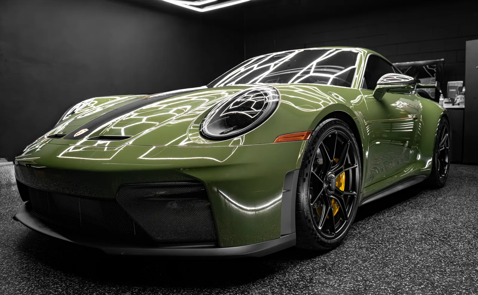 Olive green Porsche 911 GT3 with full body paint protection film in the Motorsport Wraps studio