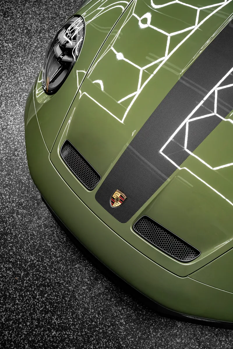 Close-up of the hood of an olive green Porsche 911 GT3