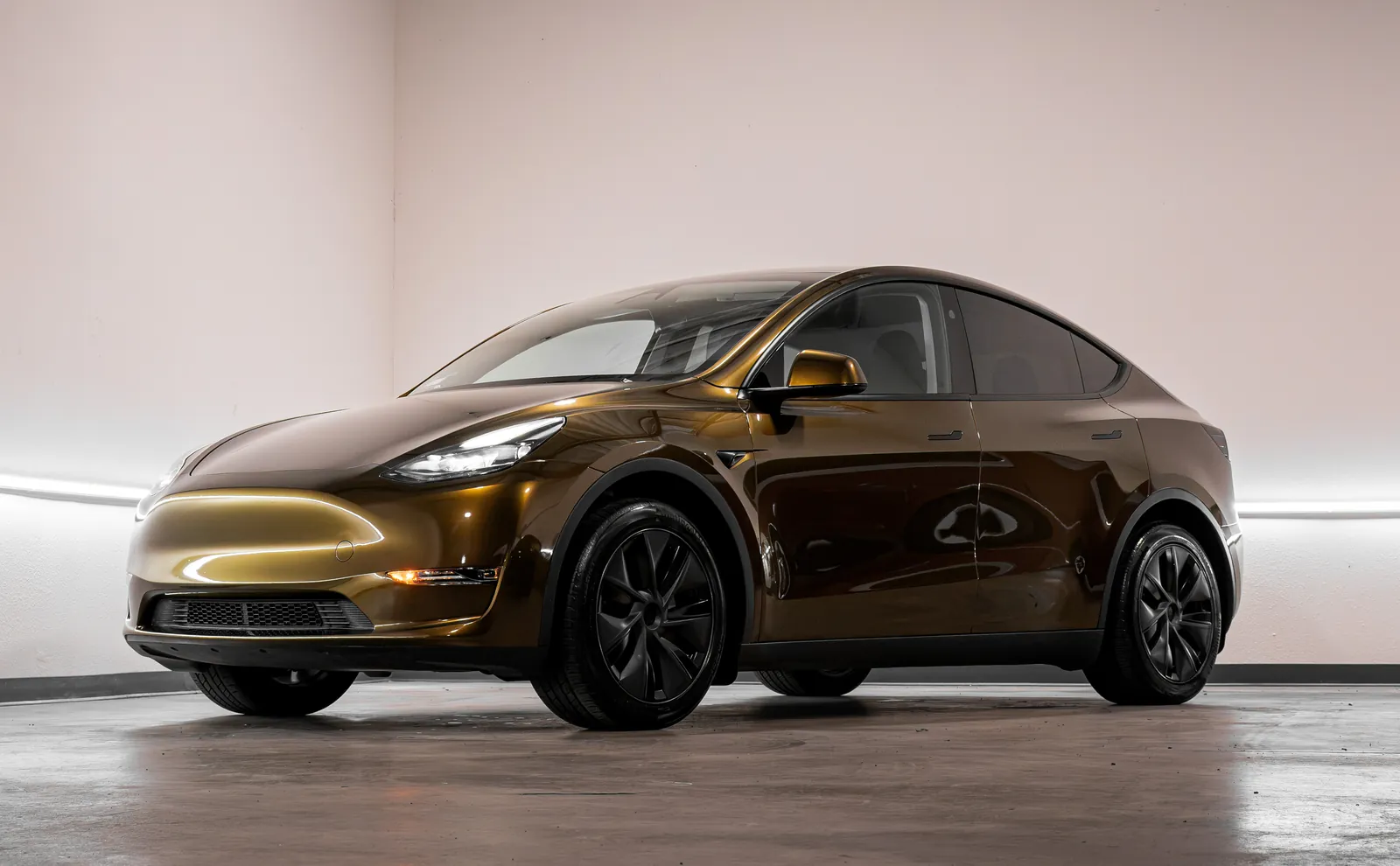 Bronze Tesla Model Y with a color change vinyl wrap