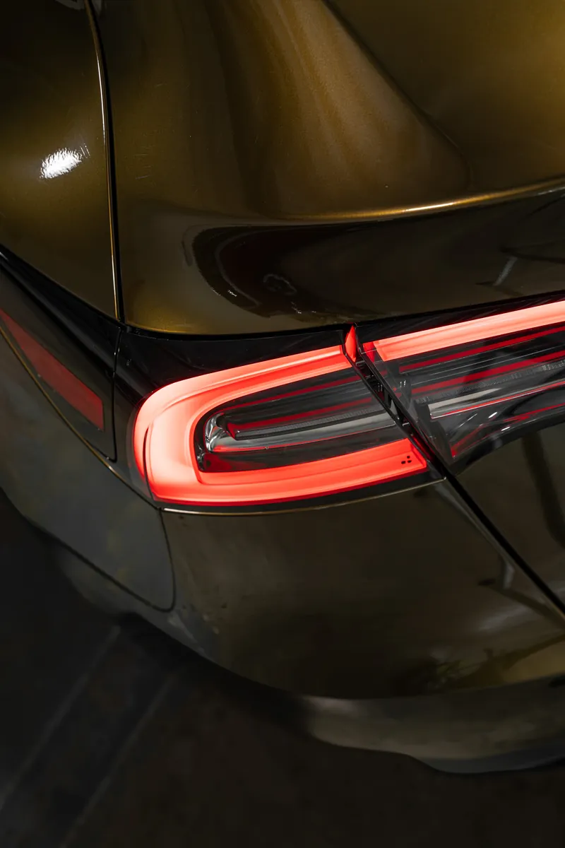 Tail light on a bronze Tesla Model Y