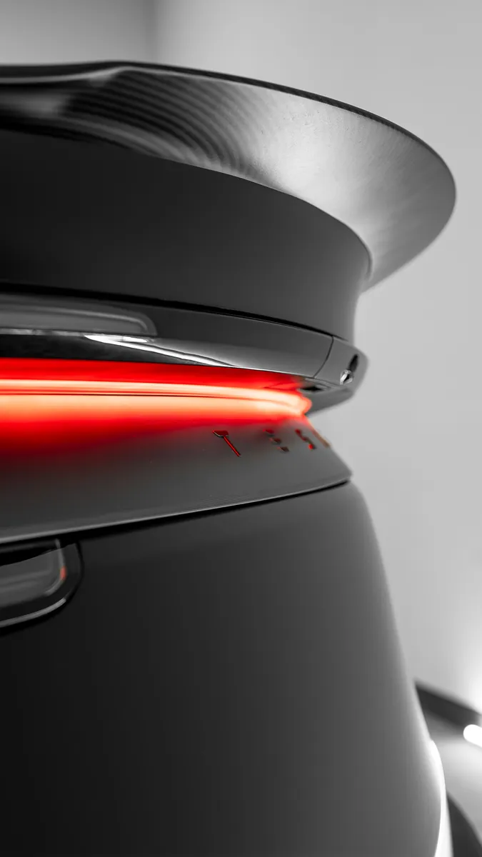 Rear spoiler and light bar on a Tesla Model Y Performance with satin Stealth film